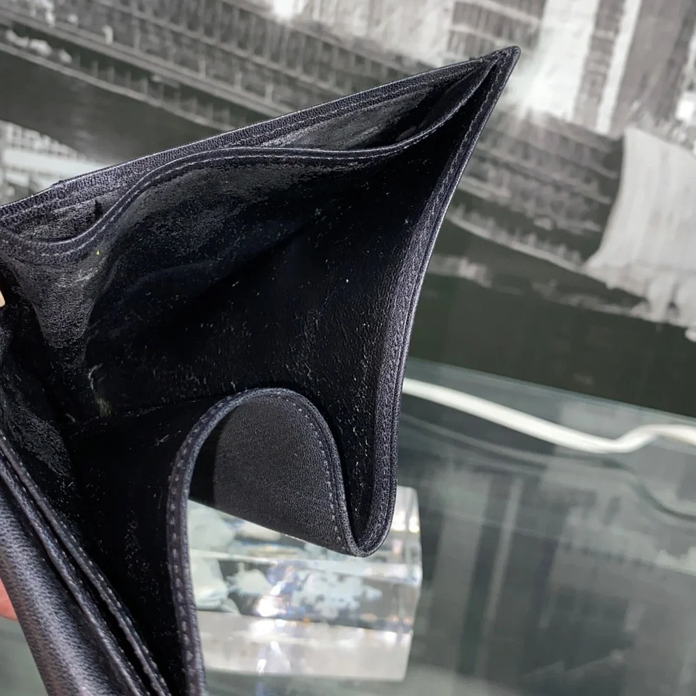 Authentic YSL Sleek black leather bifold wallet